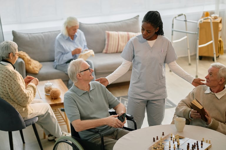Caregiver engaging with residents during activity